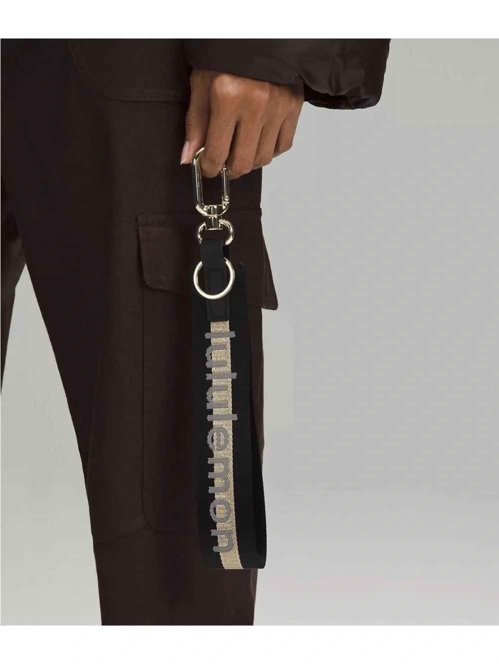 NWT Never Lost Keychain Black/ Gold Wordmark O/S